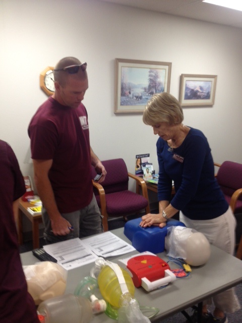 Kevin Wright instructing Wendy Hearn, FNP how to perform CPR